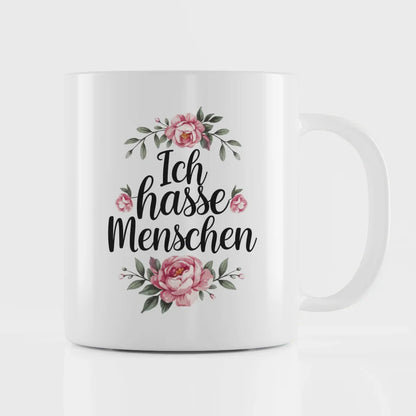 Lustige Sprüche Tasse mit blumigem Design Ich hasse Menschen in Schwarz