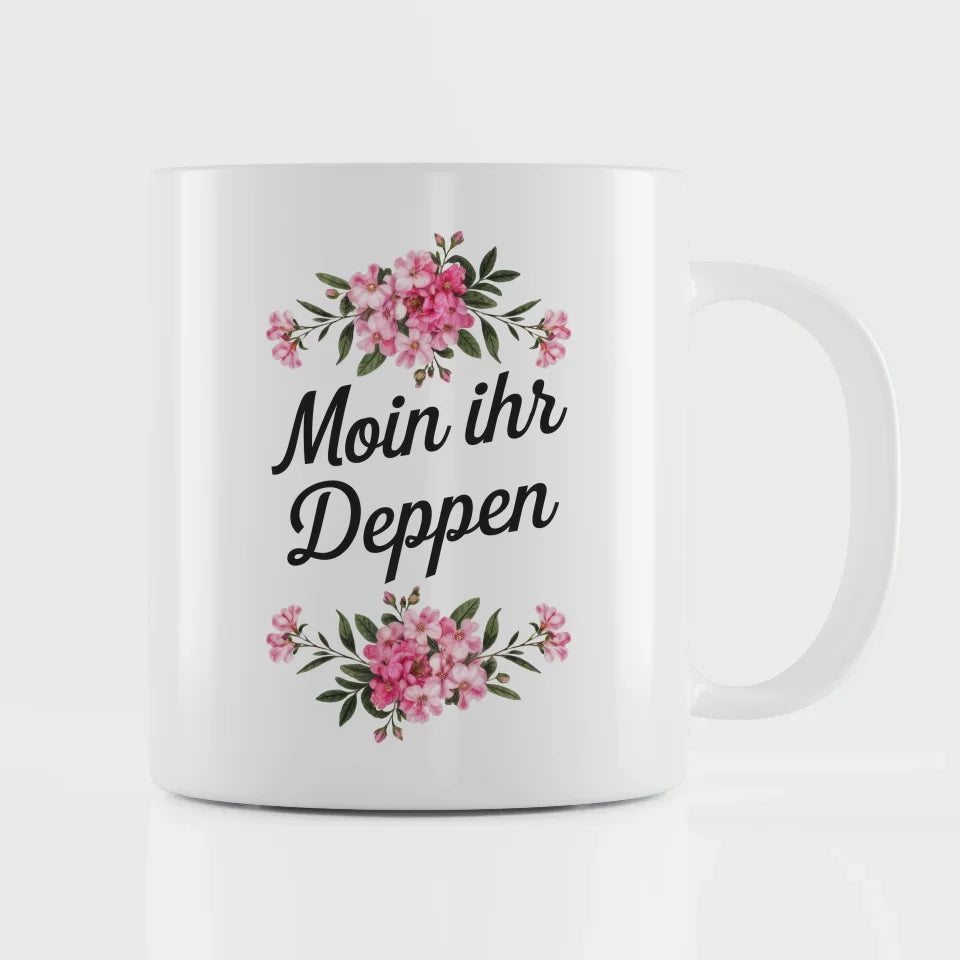 Lustige Tasse mit Spruch Moin ihr Deppen und Blumenarrangement