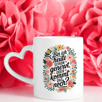 Lustige Tasse mit motivierendem Spruch und buntem Blumenmuster
