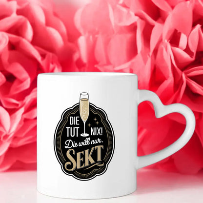 Lustige Tasse mit Abzeichen und Spruch die tut nix Sekt