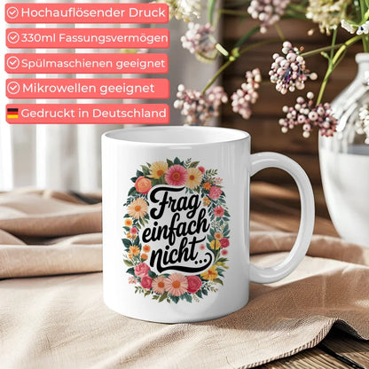 Lustige Tasse mit Frag einfach nicht und bunten Blumen